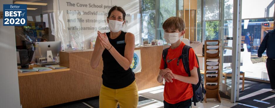 Student and teacher wearing masks