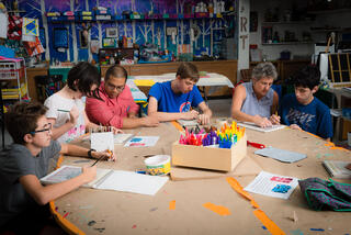 Teachers doing art activities with students